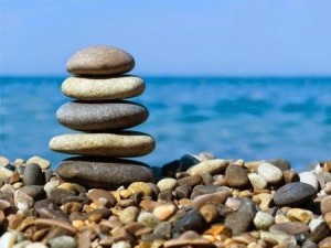 Cairn by the seaside illustrating relaxation and stress reduction
